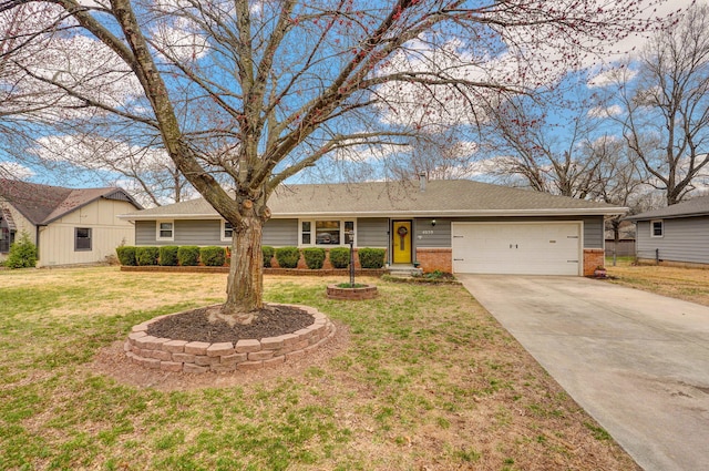 ranch-style home featuring brick siding, driveway, an attached garage, and a front yard