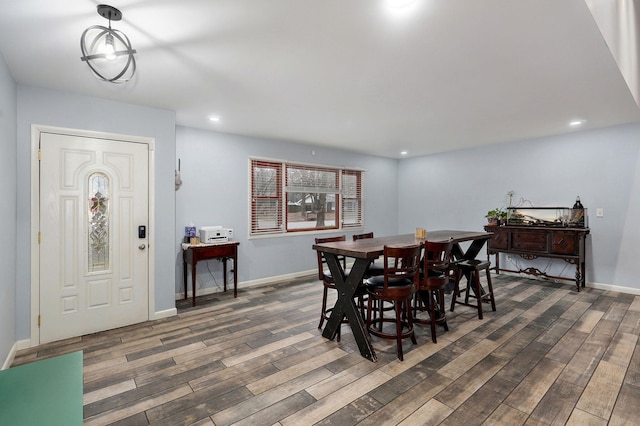 dining room featuring recessed lighting, baseboards, and wood finished floors