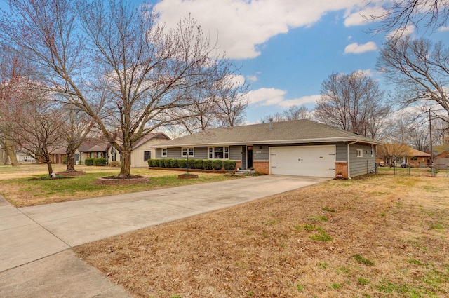 single story home with a front yard, fence, driveway, an attached garage, and brick siding