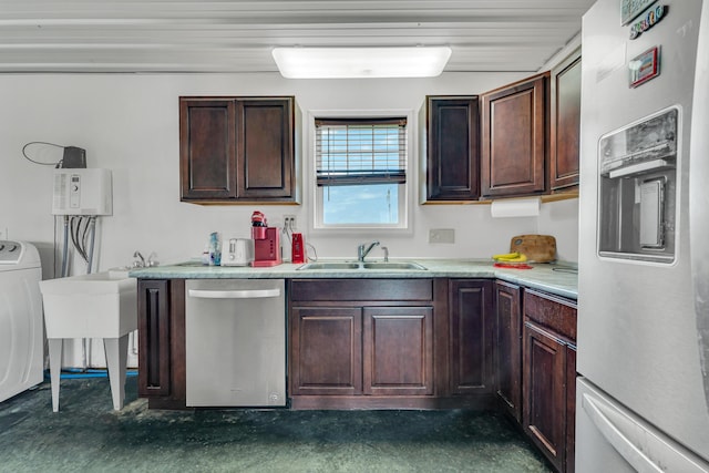 kitchen featuring washer / dryer, a sink, dark brown cabinetry, stainless steel dishwasher, and fridge with ice dispenser