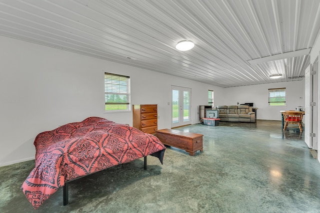 bedroom with access to exterior and french doors