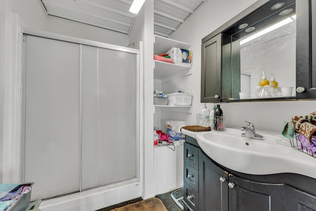 full bath with vanity and a shower stall