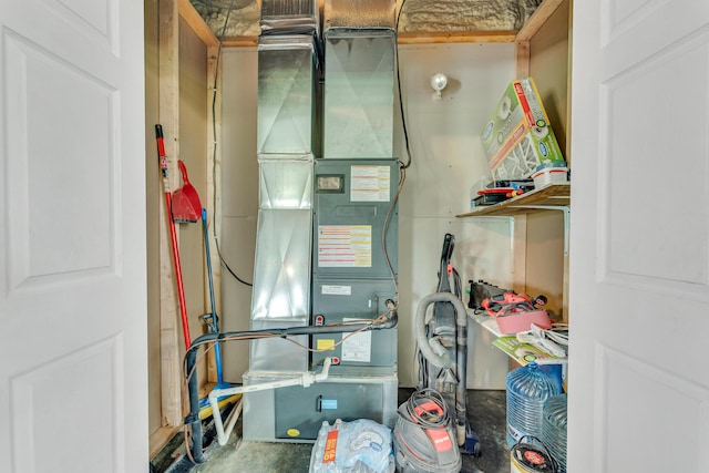 utility room with heating unit