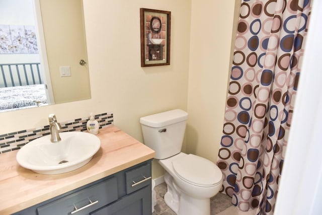 bathroom featuring decorative backsplash, toilet, vanity, and a shower with shower curtain