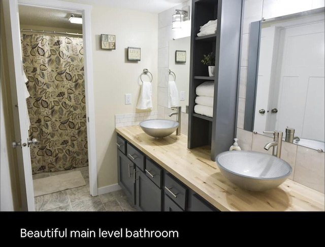 bathroom with double vanity and a sink