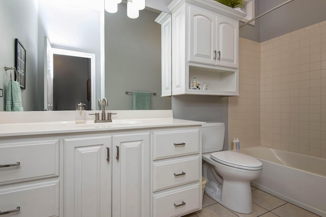 full bathroom featuring tile patterned flooring, toilet, vanity, and washtub / shower combination