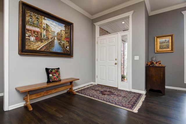 foyer with crown molding, wood finished floors, and baseboards