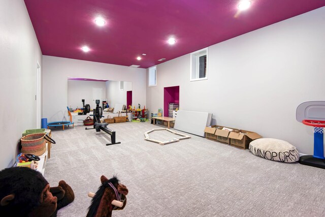 exercise room with recessed lighting and carpet floors