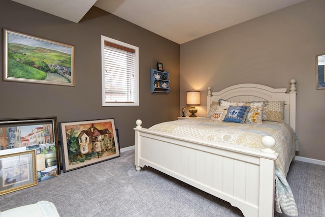 carpeted bedroom featuring baseboards