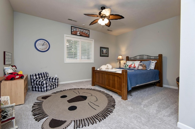 bedroom with carpet flooring, visible vents, baseboards, and ceiling fan