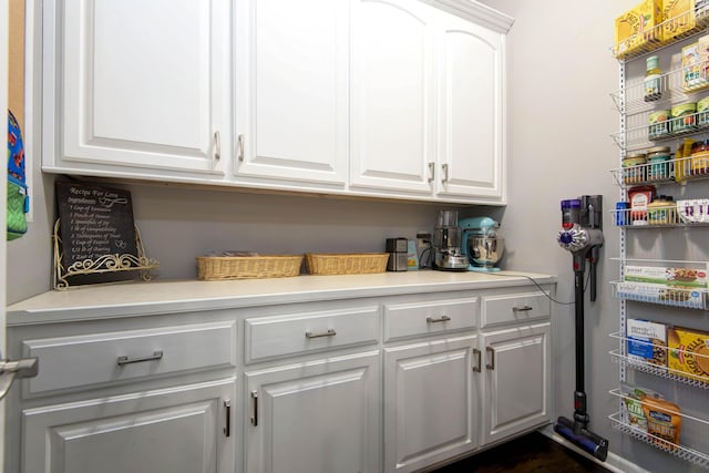 interior space with white cabinets and light countertops