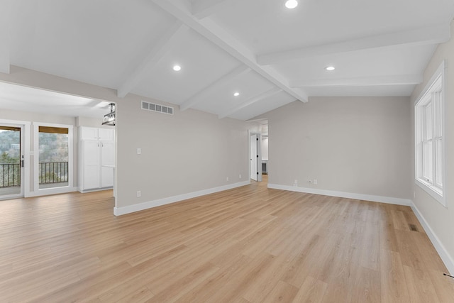 unfurnished room featuring vaulted ceiling with beams, baseboards, visible vents, and light wood finished floors