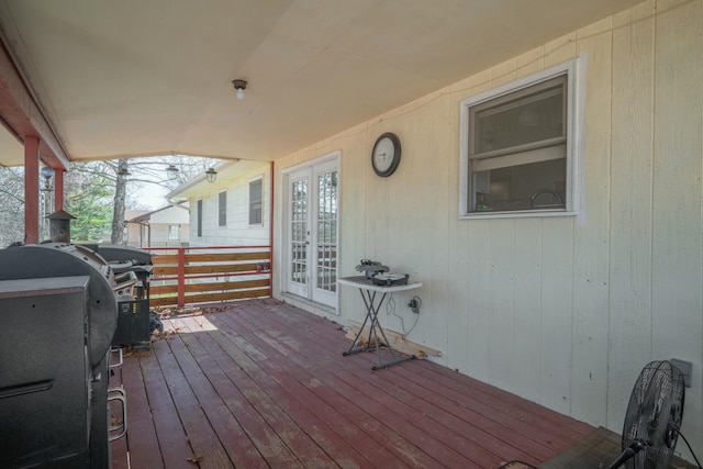 wooden terrace featuring grilling area and french doors