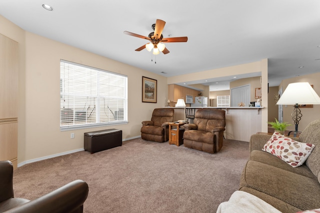 carpeted living area with recessed lighting, baseboards, and ceiling fan