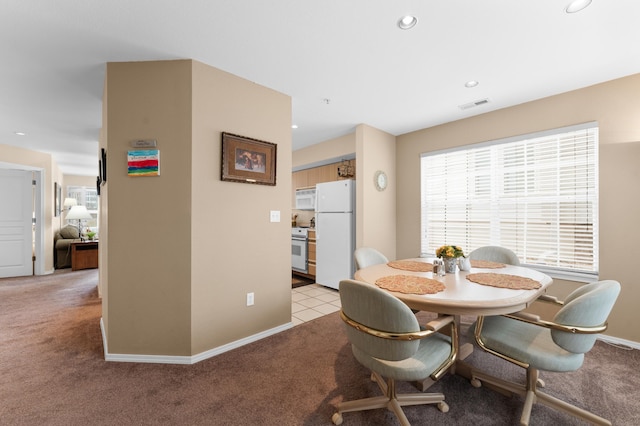 dining space with recessed lighting, visible vents, light carpet, and baseboards