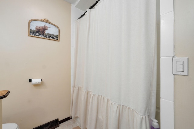 bathroom featuring baseboards