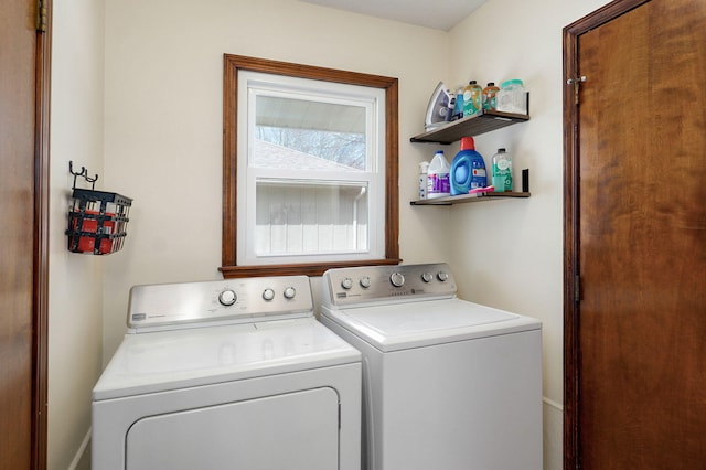 clothes washing area featuring laundry area and separate washer and dryer