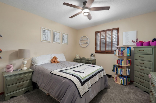 carpeted bedroom with a textured ceiling and ceiling fan