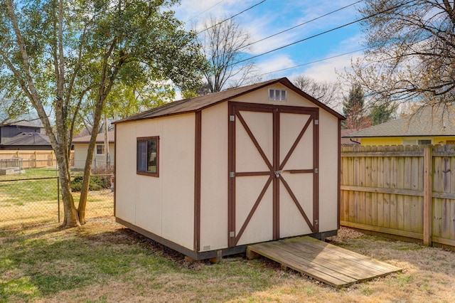 view of shed featuring a fenced backyard