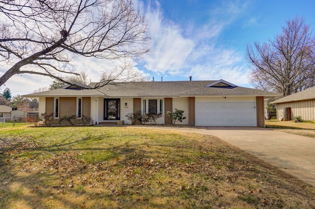 ranch-style house with driveway, fence, a front yard, a garage, and brick siding