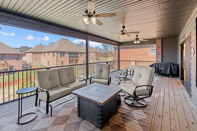 deck with ceiling fan, an outdoor living space, and grilling area