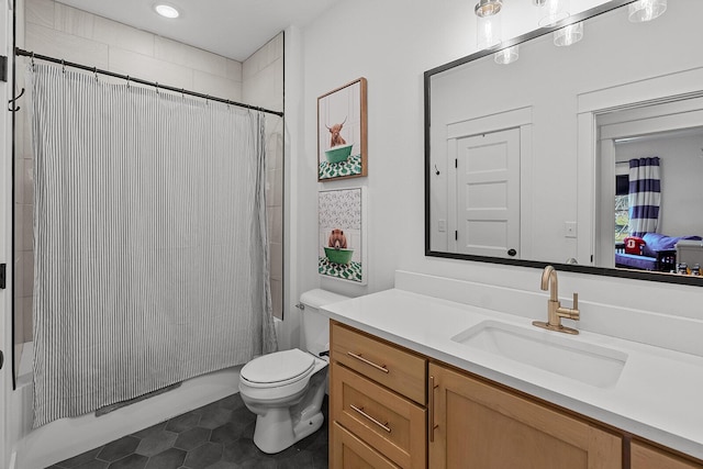 full bath featuring vanity, toilet, and shower / bath combo