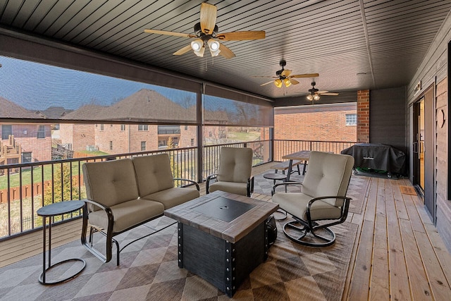 wooden terrace with outdoor lounge area, area for grilling, and a ceiling fan