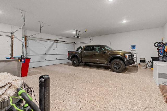 garage featuring a garage door opener