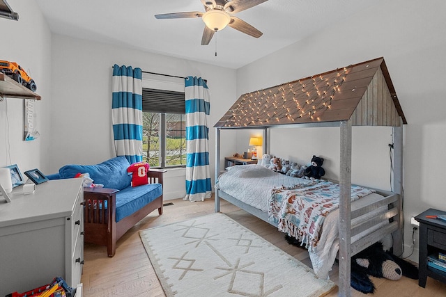 bedroom featuring ceiling fan and light wood-style floors