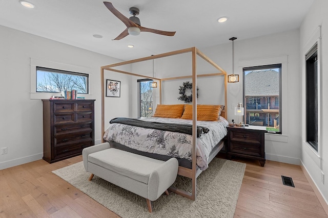 bedroom with visible vents, baseboards, recessed lighting, light wood-style floors, and a ceiling fan