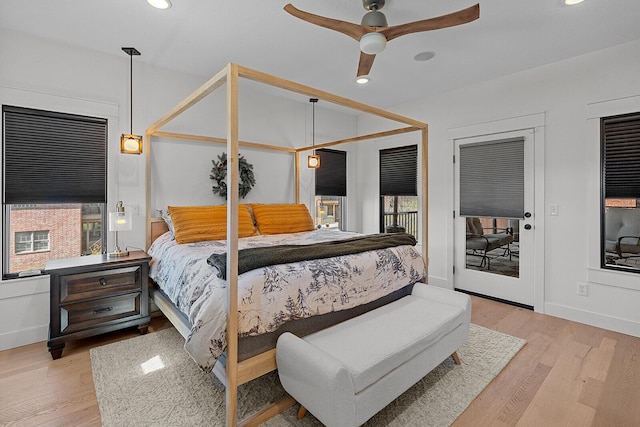 bedroom with access to exterior, recessed lighting, baseboards, and wood finished floors