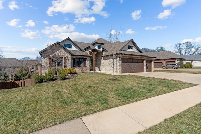 view of front facade featuring driveway, stone siding, a front lawn, and an attached garage