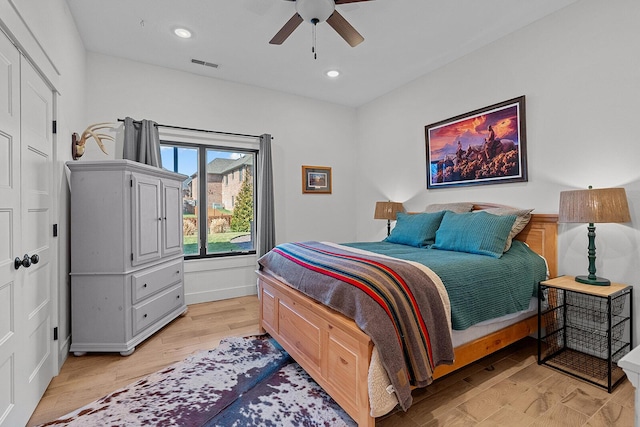 bedroom featuring visible vents, recessed lighting, a ceiling fan, and light wood-style floors