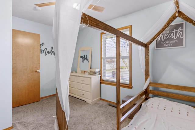 carpeted bedroom with baseboards