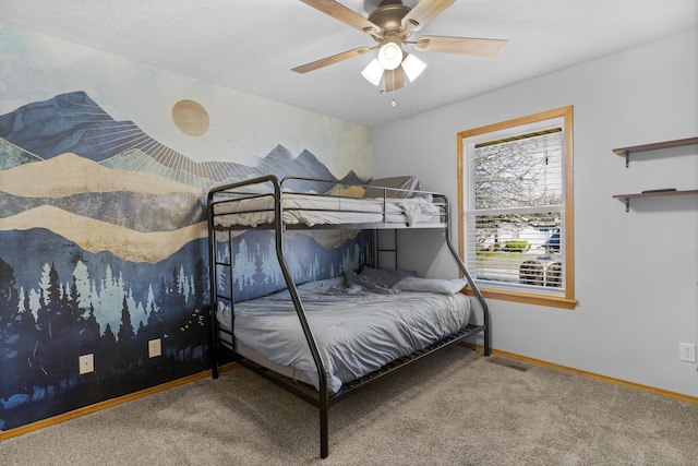 carpeted bedroom featuring visible vents, ceiling fan, and baseboards