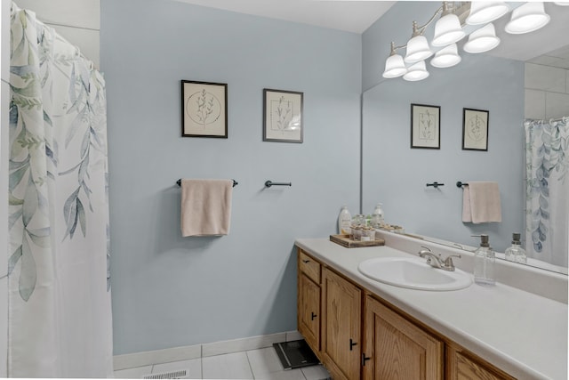 full bathroom with tile patterned floors, baseboards, a shower with curtain, and vanity