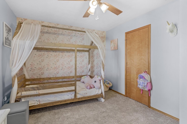 unfurnished bedroom featuring carpet flooring, ceiling fan, and baseboards