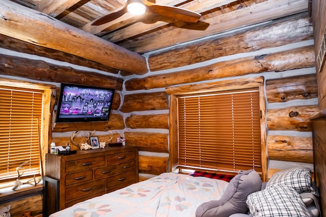 bedroom featuring beamed ceiling