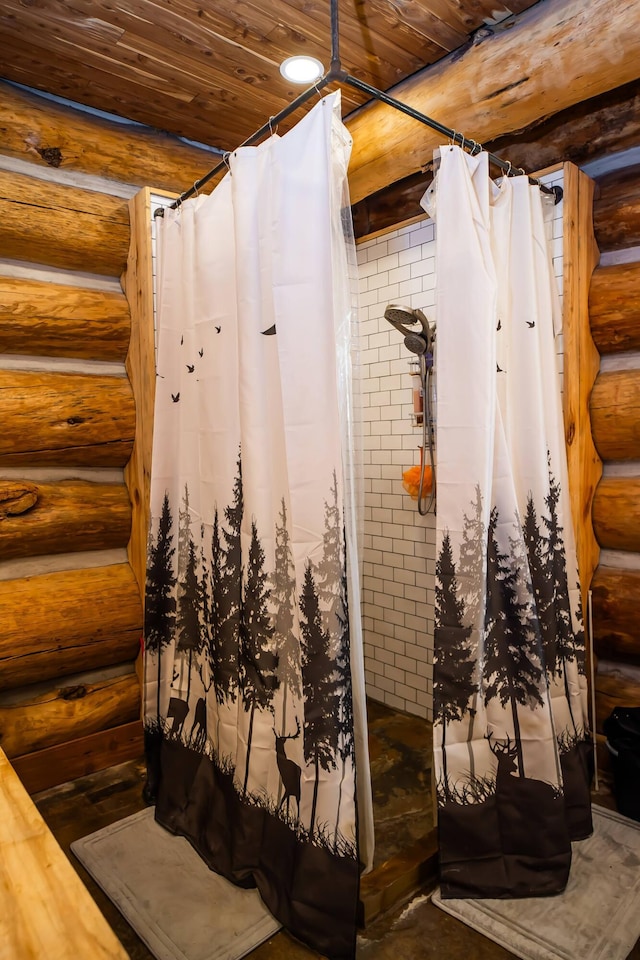 bathroom featuring a shower with shower curtain, wood ceiling, and rustic walls