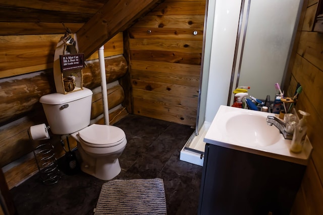 bathroom featuring vanity, toilet, wood walls, and log walls