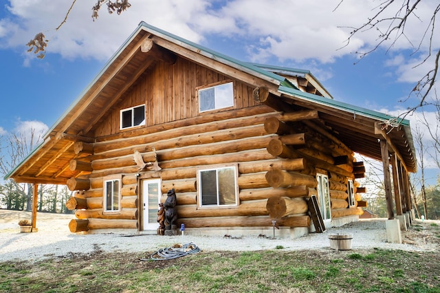 view of side of property with log exterior