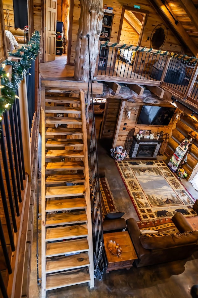 stairs featuring wooden walls