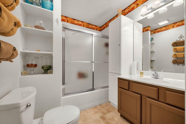 full bath featuring enclosed tub / shower combo, toilet, vanity, and tile patterned flooring