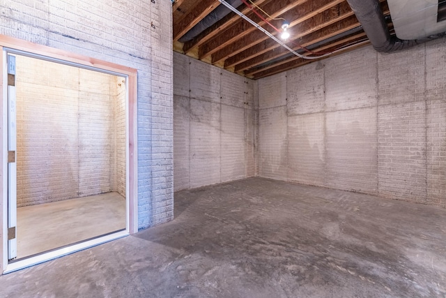 unfinished basement with brick wall