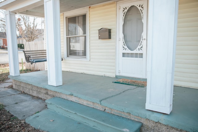 property entrance featuring covered porch