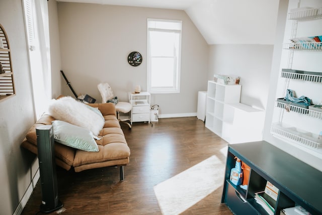 sitting room with lofted ceiling, wood finished floors, and baseboards