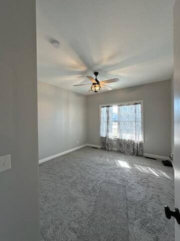 unfurnished room with baseboards, carpet floors, and ceiling fan