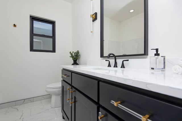 bathroom featuring recessed lighting, marble finish floor, toilet, and vanity