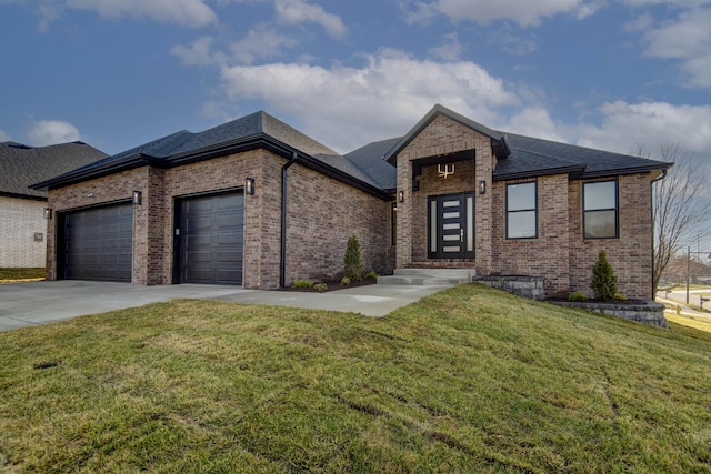 view of front facade with driveway, roof with shingles, an attached garage, a front lawn, and brick siding