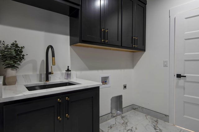 clothes washing area featuring hookup for a washing machine, cabinet space, electric dryer hookup, marble finish floor, and a sink